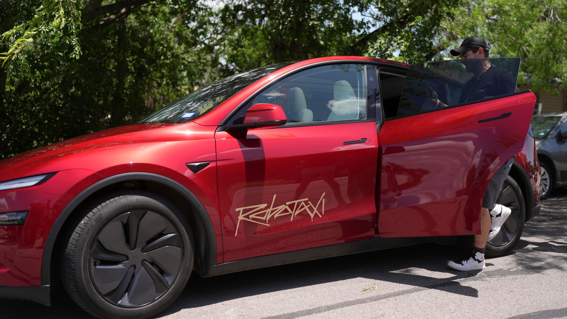 Videos show driverless Teslas braking hard without warning - and on wrong side of the road