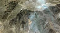 A satellite overview shows excavators at tunnel entrances at the Fordow site in Iran. Pic: Maxar/Reuters