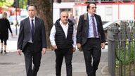 Hamit Coskun (centre) charged with religiously aggravated public order offence after Koran burnt outside Turkish consulate. Pic: PA