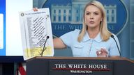 White House press secretary Karoline Leavitt holds a note from President Trump to Federal Reserve chair Jerome Powell. Pic: AP