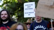 People from the disability rights group, Disabled People Against Cutss  hold a protest in Parliament Square.
Pic: Reuters