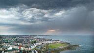 Storm clouds above Whitley Bay in North Tyneside on Saturday. Pic: PA