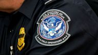 A customs agent wears a patch for the US Customs and Border Protection agency. File pic: AP