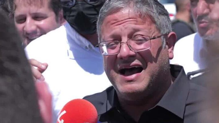 Itamar Ben-Gvir speaks with reporters at the site of a strike.