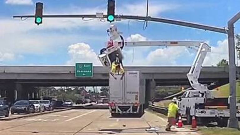 Worker left hanging over motorway after lorry crash