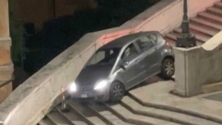 An 81-year-old man drove a car down Rome's iconic Spanish Steps before getting stuck halfway down.