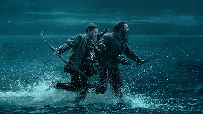 Alfie Williams and Aaron Taylor-Johnson being chased on the causeway. Pic: Sony Pictures Entertainment