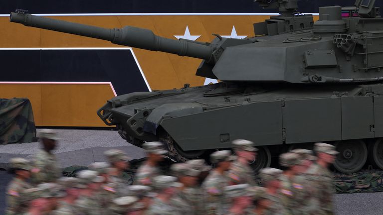 A tank and soldiers. Pic: Reuters
