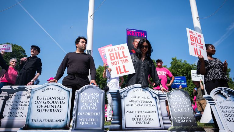 Anti-assisted dying campaigners in Parliament Square. Pic: PA