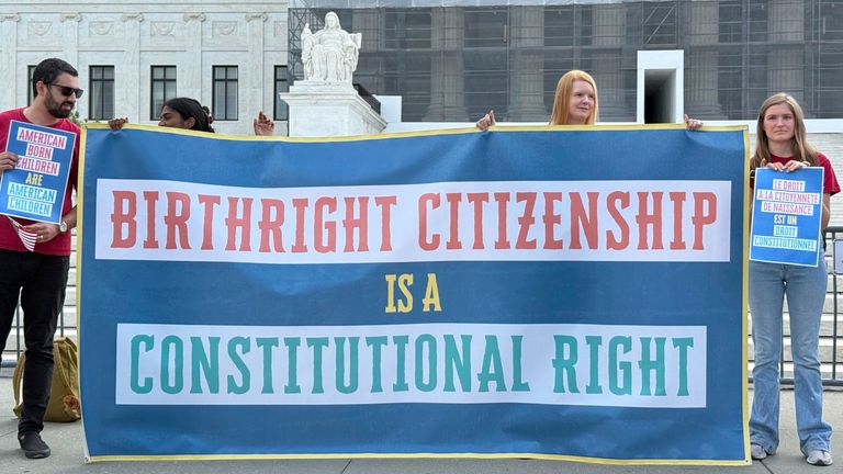 People demonstrate in front of the Supreme Court in Washington regarding birthright citizenship