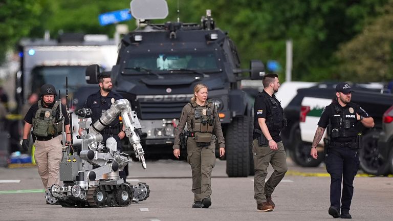 A bomb disposal robot with law enforcement on a Boulder street. Pic: AP