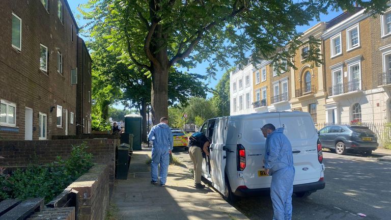 Police at the scene at Mornington Place, Camden, north London where 69-year-old Jennifer Abbott was found stabbed in her home. Pic: PA 