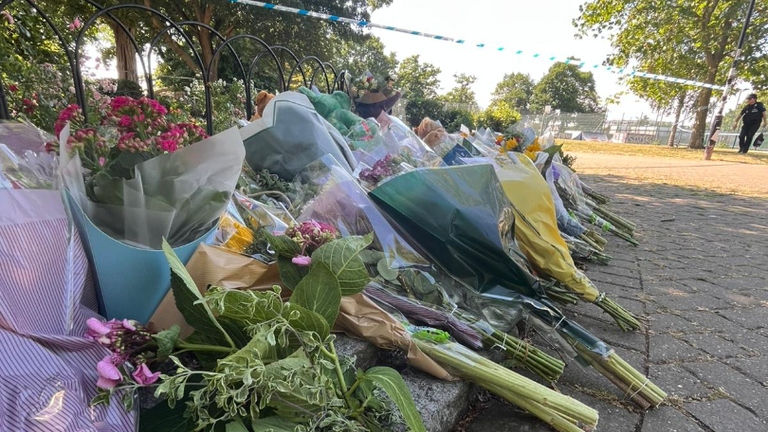 Flowers, cards and soft toys have been left near the scene