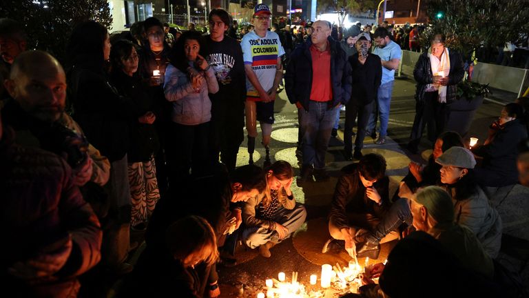People gather outside the hospital where Mr Uribe Turbay is 'sighting for his life. Pic: Reuters