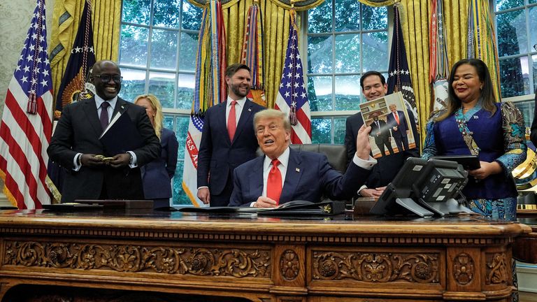 Donald Trump with DRC's Therese Kayikwamba Wagner and Rwanda's Olivier Nduhungirehe at the White House. Pic: Reuters