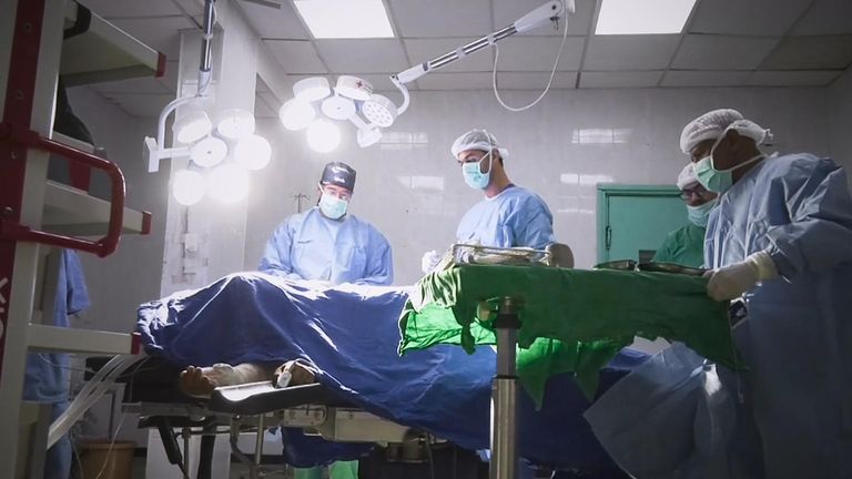 Dr Tom Potokar performing surgery in Gaza, filmed for Sky's Alex Crawford