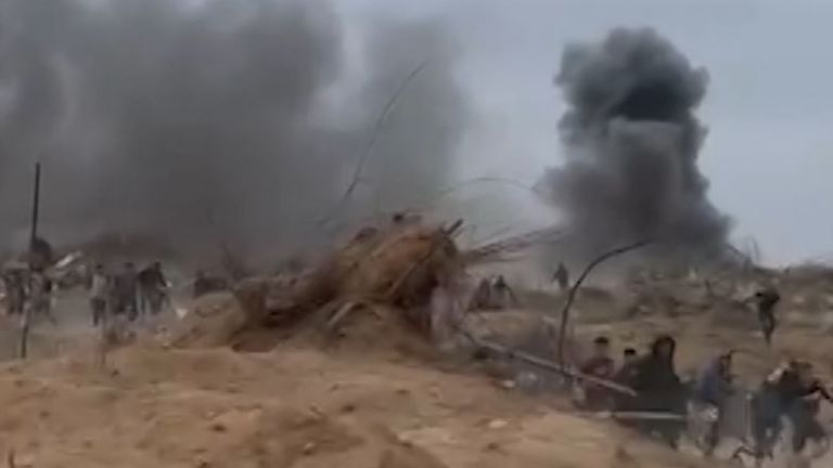 Thick smoke rises into the air after explosions