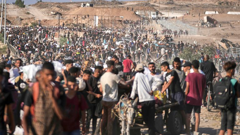 Palestinians carry humanitarian aid packages near the Gaza Humanitarian Foundation distribution centre in Khan Younis.
Pic: AP