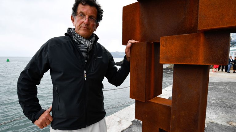 Sir Anthony Gormley poses next to his sculpture LOOK