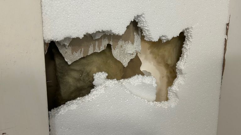 A hole in the wall in Willow Rise patched up with polystyrene
