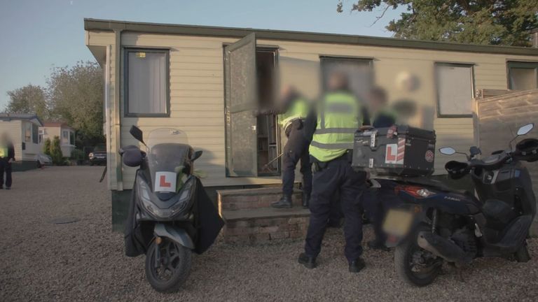A raid on a caravan in Surrey with suspected links to illegal workers. Pic: Home Office