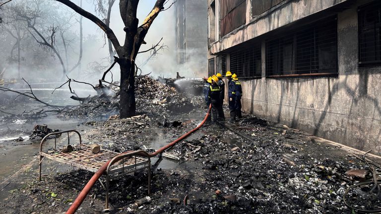Firefighters work at the site of an airplane that crashed in India's northwestern city of Ahmedabad in Gujarat state, Thursday, June12, 2025. (AP Photo/Ajit Solanki)