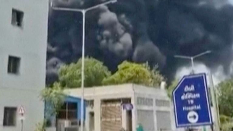 Smoke rises after an airplane crashed in Ahmedabad, Gujarat state, India, Thursday, June 12, 2025. (Mohan Nakum via AP)