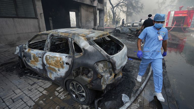 People work near the site of an airplane that crashed in India's northwestern city of Ahmedabad in Gujarat state, Thursday, June12, 2025. (AP Photo/Ajit Solanki)