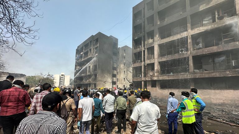 People gather near the site where an Air India plane crashed in Ahmedabad, India, June 12, 2025. REUTERS/Amit Dave