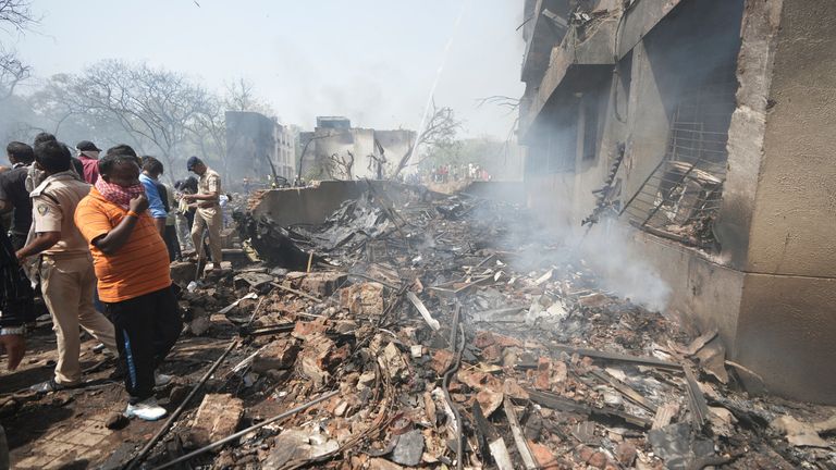 Members of the security forces work at the site of an airplane that crashed in India's northwestern city of Ahmedabad in Gujarat state, Thursday, June 12, 2025. (AP Photo/Ajit Solanki)