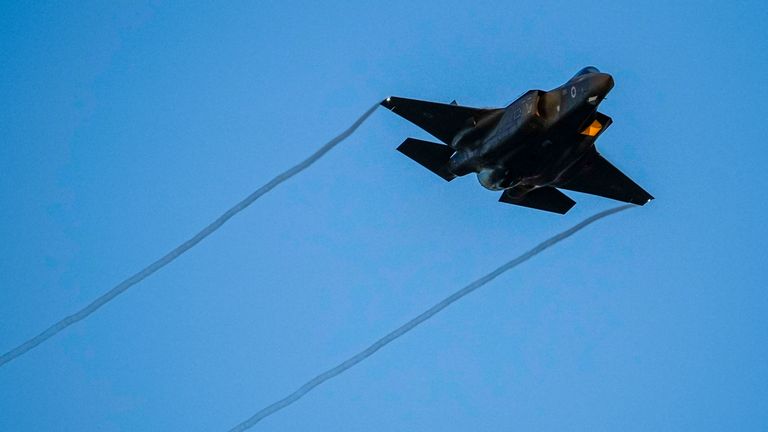 An Israeli air force F-35 war plane flies over during a graduation ceremony for new pilots in Hatzerim air force base near the southern Israeli city of Beersheba, Israel, Thursday, June 29, 2023. (AP Photo/Tsafrir Abayov)