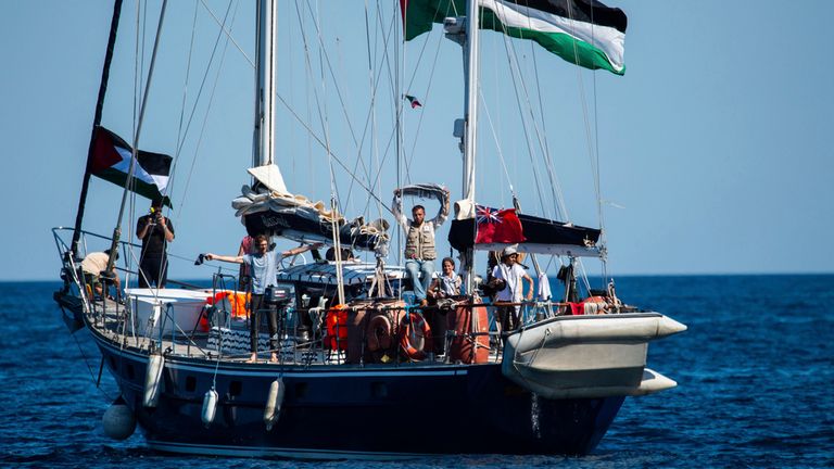 Activists of the Freedom Flotilla Coalition, board the Madleen boat, ahead of setting sail for Gaza, departing from the Sicilian port of Catania, Italy, Sunday, June 1, 2025. (AP Photo/Salvatore Cavalli)