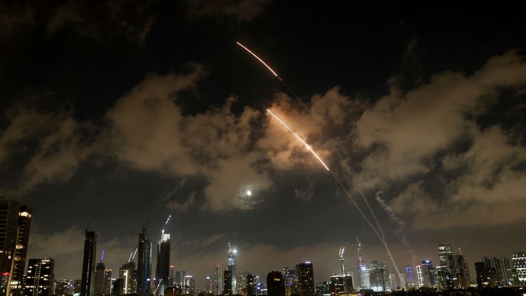 An anti-missile system operates as missiles are launched from Iran, as seen from Tel Aviv. Pic: Reuters