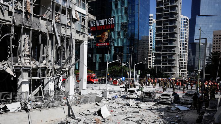 Debris can be seen on the street in Ramat Gan, Israel. Pic: Reuters/Ammar Awad