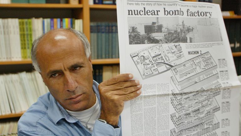 FILE - In this June 3, 2004 file photo, nuclear whistleblower, former nuclear technician Mordechai Vanunu, holds a copy of the original news