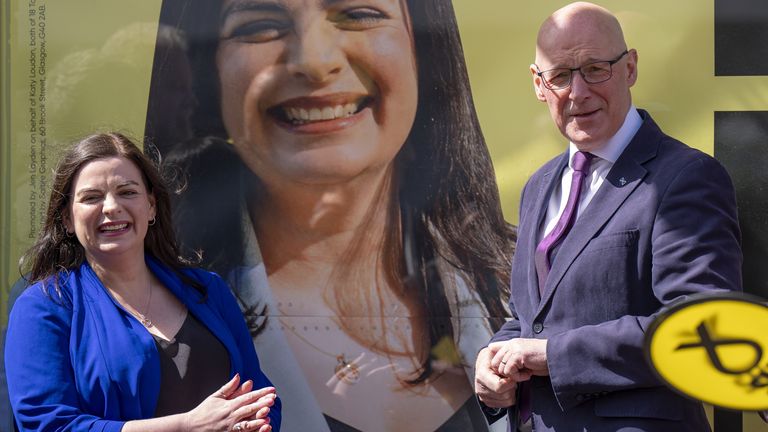 SNP Leader John Swinney joins parliamentary candidate Katy Loudon and party activists outside the party's campaign office in Hamilton, Lanar