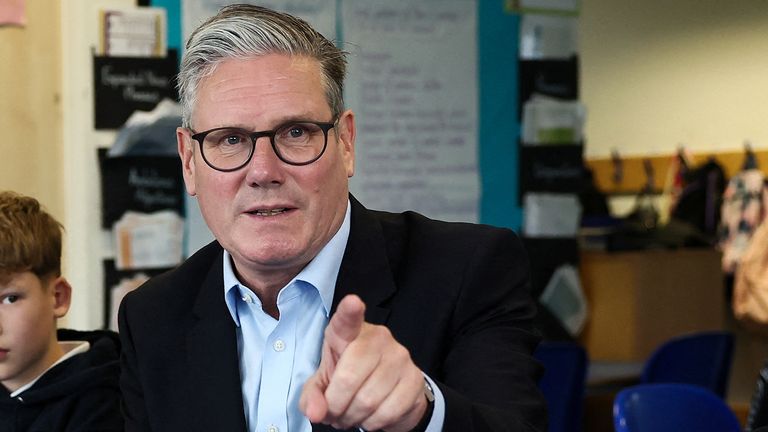 Keir Starmer visits a school to outline government plans to extend free school meals to half a million children, in Essex, Britain, June 5,