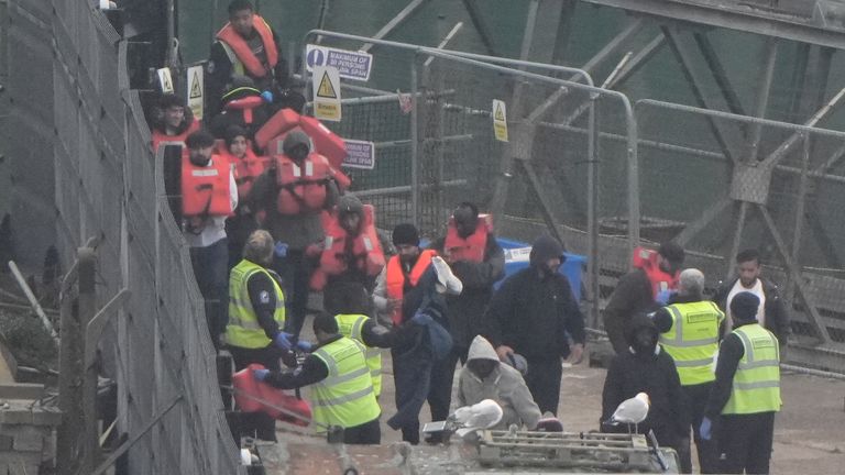 Migrants wear life jackets after being rescued from small boats in the Channel. Pic: PA