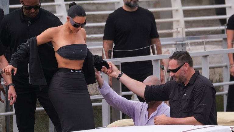 Kim Kardashian gets in a boat as she leaves from Marco Polo Airport ahead of the anticipated wedding .
Pic: Reuters