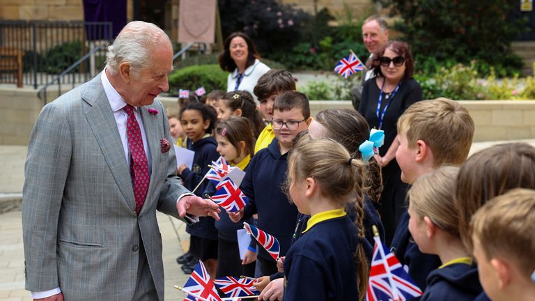 King Charles III meets local school children during his visit. Pic: PA