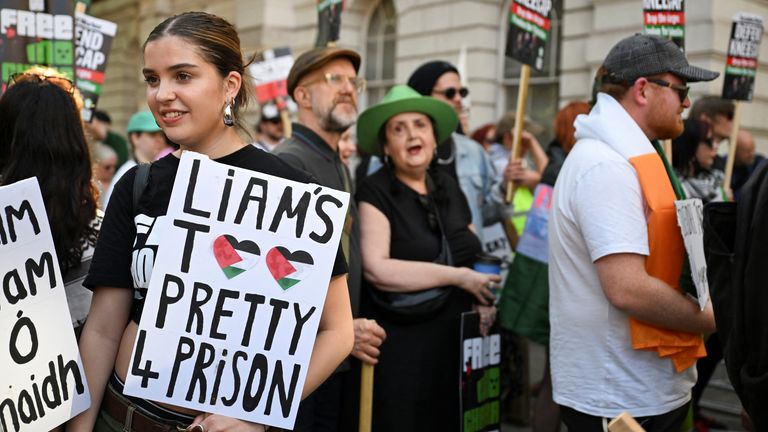 Protesters gather outside Westminster Magistrates' Court, ahead of the arrival of Kneecap member Liam O'Hanna, also known as Liam Og O hAnna