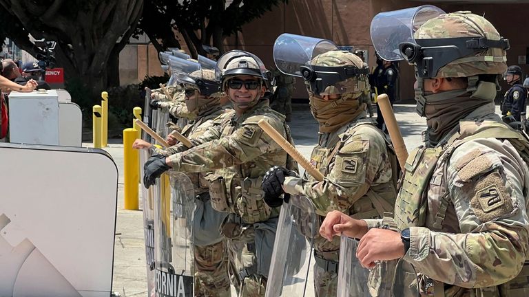 California National Guard soldiers stand at a federal agency building. Pic: AP