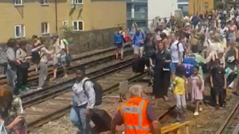 Scores of train passengers have been evacuated after some services were halted on what was the hottest day of the year in the UK so far.