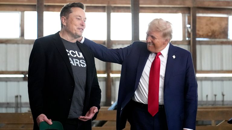 Elon Musk, left, and Republican presidential nominee former President Donald Trump attend a campaign event at the Butler Farm Show,