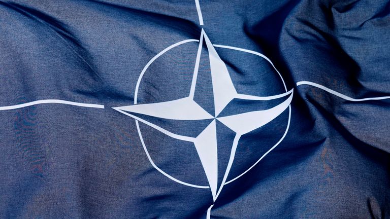 The NATO flag waves in the wind in front of the venue ahead of the upcoming NATO summit in The Hague, Netherlands, Monday, June 23, 2025. (AP Photo/Markus Schreiber)