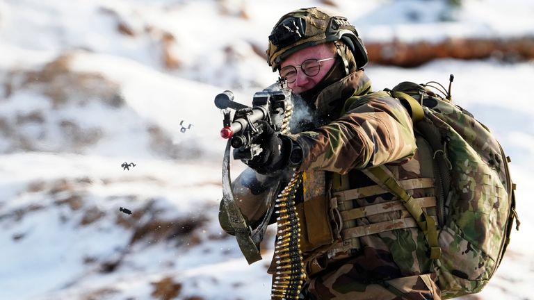 A French soldier attends the Winter Camp 23 military drills near Tapa, Estonia, Sunday, Feb. 5, 2023. Winter Camp 23 incorporates surge assets from French infantry and UK aviation in addition to the existing forces deployed on regular rotation from France, Denmark and UK. (AP Photo/Pavel Golovkin)