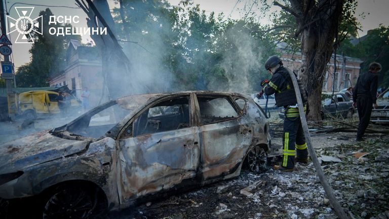A firefighter works at the site of a Russian drone strike, amid Russia's attack on Ukraine, in Odesa, Ukraine in this handout picture releas