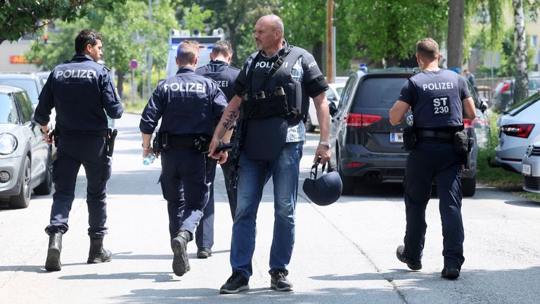 Police officers attend the scene of a shooting at a school in Graz, Austria.
Pic: AP