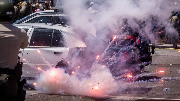 Fireworks amid police standoffs with protsters in Paramount, Los Angeles on Saturday. Pic: Reuters