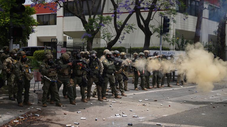 Tear gas is fired at protesters in Paramount on Saturday. Pic: Reuters